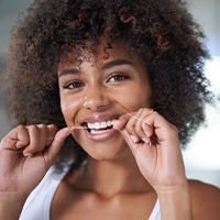 St. Albans patient brushing near dental implant 