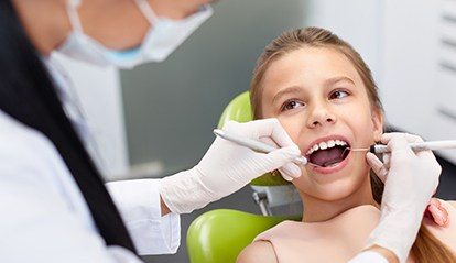 Smiling child in dental chair