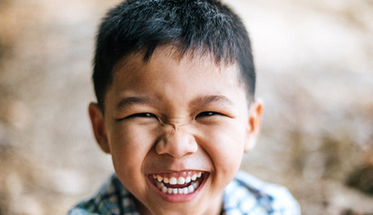 smiling child playing outside