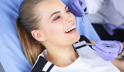 Woman receiving dental exam