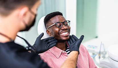 Man smiling at the dentist