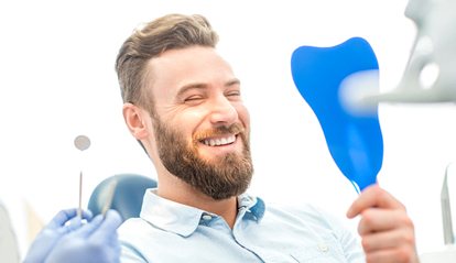 Smiling man in dentist’s chair