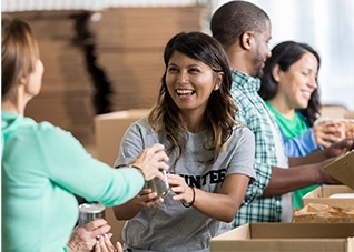 Group of people working in a line at a food drive