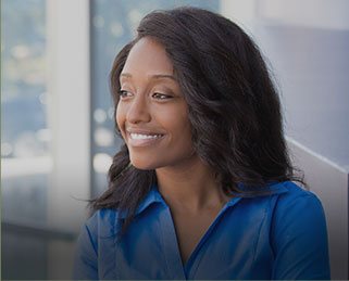 Smiling woman sitting at desk