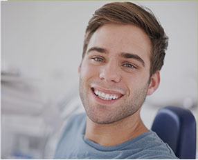 Smiling man in dental chair