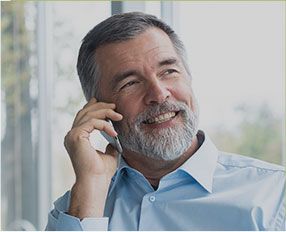 Smiling man on cell phone