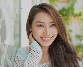 Woman smiling outdoors