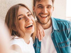 Smiling couple with healthy teeth