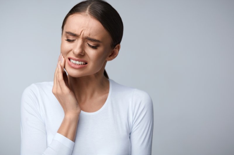 Woman experiencing tooth pain