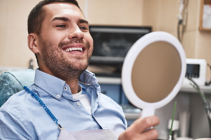 a patient smiling during a dental consultation